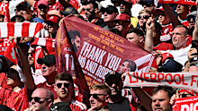 LIVERPOOL, ENGLAND - MAY 24: A fan of Liverpool (obscured) holds up a banner showing support for Mohamed Salah and Andrew Robertson prior to the Premier League match between Liverpool and Brentford at Anfield on May 24, 2026 in Liverpool, England. (Photo by Liverpool FC/Liverpool FC via Getty Images)