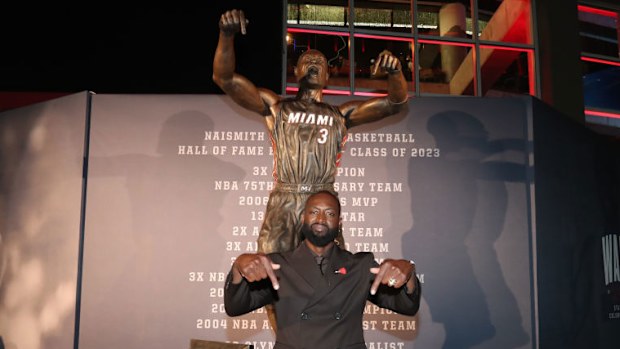 Dwyane Wade poses for a photo during Dwyane Wade's statue unveiling.