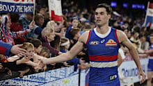 Sam Darcy of the Bulldogs celebrates with fans.