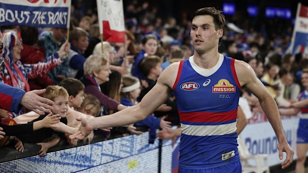 Sam Darcy of the Bulldogs celebrates with fans.