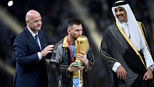 Lionel Messi of Argentina kisses the FIFA World Cup.