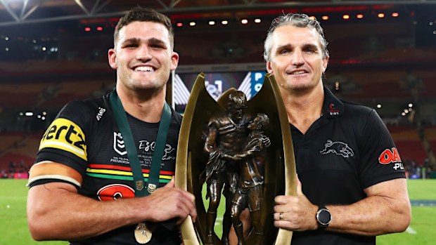 Nathan and Ivan Cleary holding the premiership trophy.