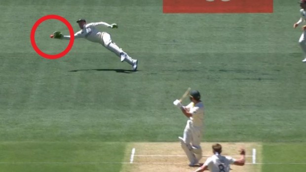Jos Buttler takes the catch to remove Marcus Harris.