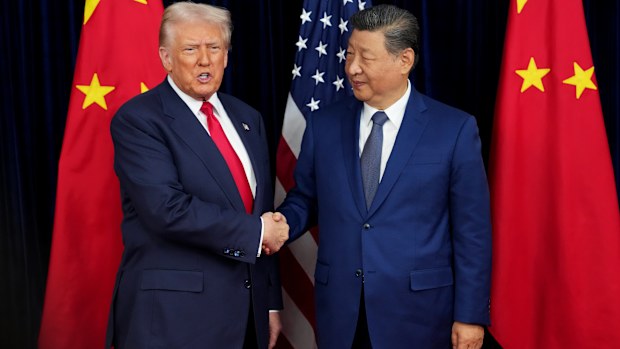 U.S. President Donald Trump greets Chinese President Xi Jinping ahead of a bilateral meeting at Gimhae Air Base on October 30, 2025 in Busan, South Korea.