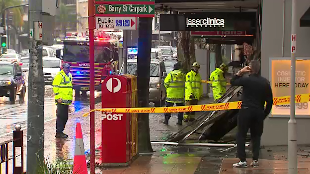 In Neutral Bay, the downpour was so heavy, a shop awning collapsed onto the footpath.