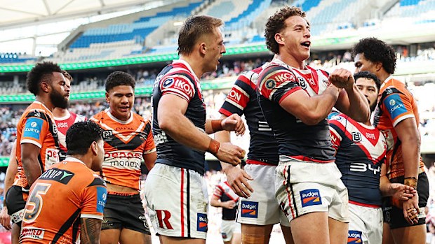 Mark Nawaqanitawase of the Roosters celebrates scoring a try.