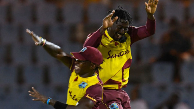 Hayden Walsh celebrates after taking the crucial wicket of Mitchell Marsh.