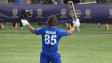 Joe Burns celebrates a century for Italy. 