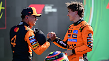 Lando Norris and Oscar Piastri embrace at the Dutch Grand Prix