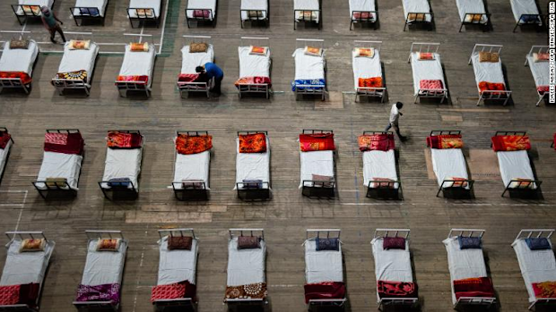 Workers prepared beds for a COVID-19 isolation centre that was set up inside a stadium in Srinagar on April 27. 