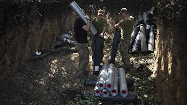 Ukrainian servicemen prepare ammunition for self-propelled howitzer "Bohdana" before firing towards Russian positions near Bakhmut, Ukraine, Friday, July 7, 2023.