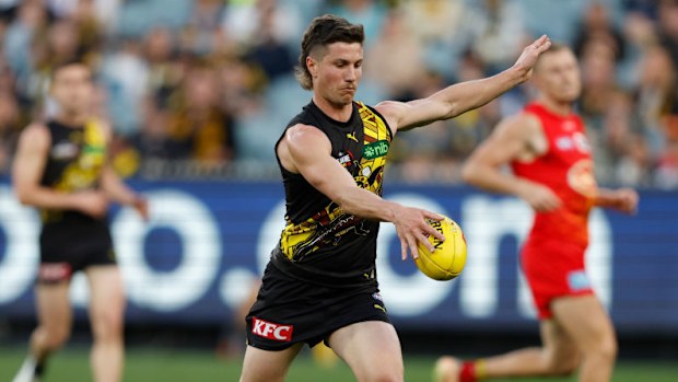 Liam Baker kick a goal during the round 24 AFL match between Richmond Tigers and Gold Coast Suns.