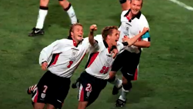 Michael Owen celebrates scoring for England.
