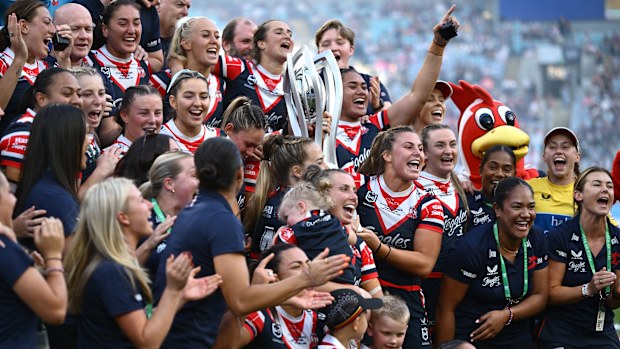 Sydney Roosters players and staff celebrate after winning the 2024 NRLW grand final.