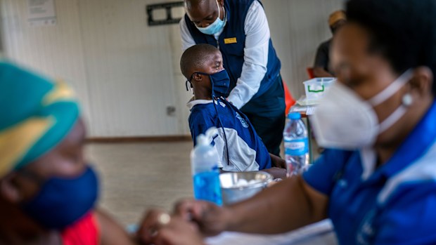 Residents get their COVID-19 jabs in Lawley, South Africa.
