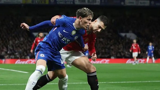 Chelsea's Alejandro Garnacho tussles with former Manchester United team-mate Diogo Dalot.