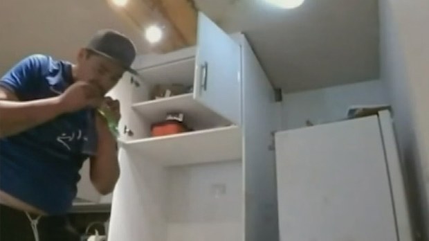 Once he was inside the unit, the man picked out a pair of shoes, had a drink of milk and ate an ice block.