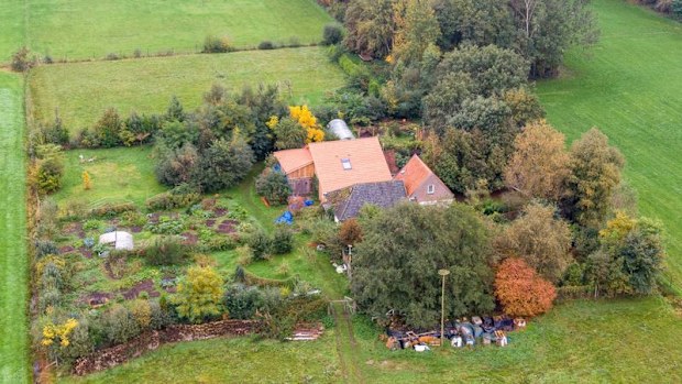 A drone photo of the farm where a father and six children had been living in the cellar. 