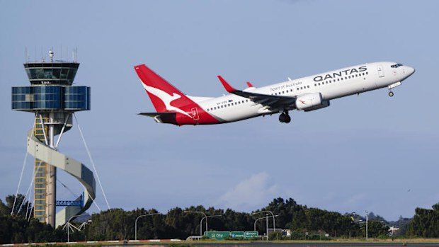 A Qantas Boeing 737 passenger plane takes off from Sydney Airport