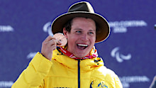 Bronze medallist Ben Tudhope of Team Australia celebrates on the podium.