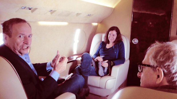 This undated photo released by Democrats on the House Oversight Committee shows Larry Summers, left, his wife, Elisa New, centre, and Woody Allen on an plane.