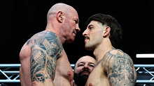 Barry Hall and Curtis Scott square off at the official weigh ins. 