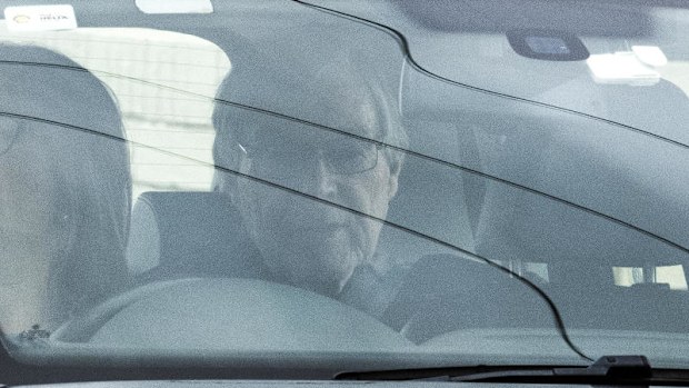 Cardinal George Pell seen inside the vehicle.