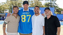 Rob Gronkowski poses for a photo with Melbourne Storm players. 