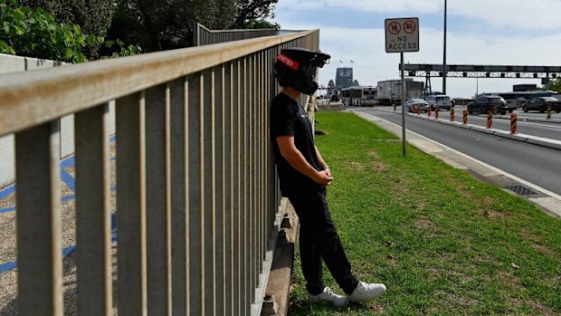 Stage name Sur Ronster an American content creator in his twenties specialising in electric bikes at Observatory Hill near the Sydney Harbour Bridge.
