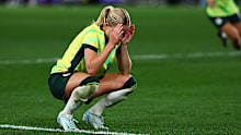 Kaitlyn Torpey of Australia celebrates kicking a goal.