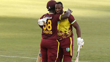 PERTH, AUSTRALIA - FEBRUARY 13: Andre Russell of the West Indies celebrates his half century with Sherfane Rutherford during game three of the Men's T20 International series between Australia and West Indies at Optus Stadium on February 13, 2024 in Perth, Australia. (Photo by Paul Kane/Getty Images)