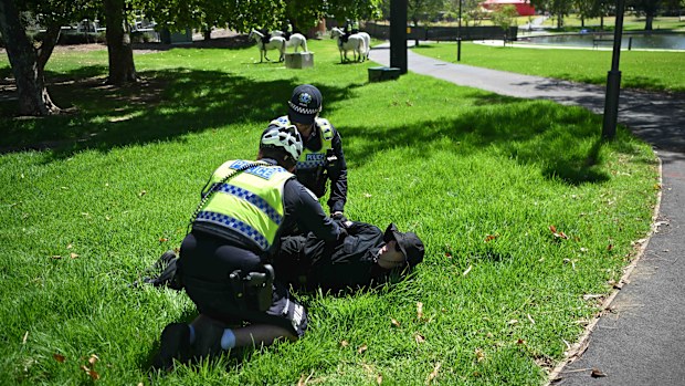ADELAIDE, AUSTRALIA - JANUARY 26: Members of the National Socialist Network (NSN) are arrested as they hold in the East2 Parklands a counter protest on North Terrace on January 26, 2025 in Adelaide, Australia. Australia Day, formerly known as Foundation Day, is the official national day of Australia and is celebrated annually on January 26 to commemorate the arrival of the First Fleet to Sydney in 1788. Many indigenous Australians refer to the day as 'Invasion Day' and there is a small but growi