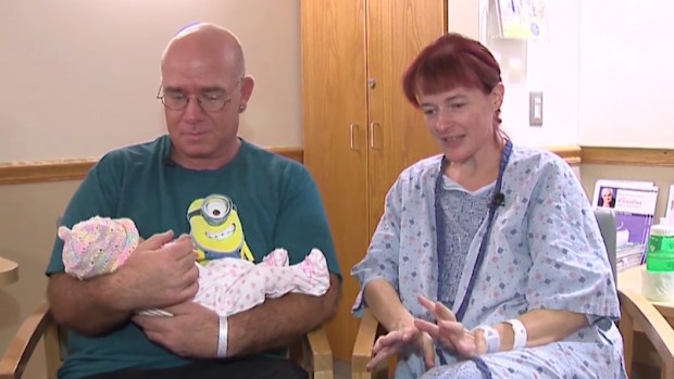 Ms Brown, her husband and newborn Carolyn Rose. (The Huffington Post/Mathew Mills)