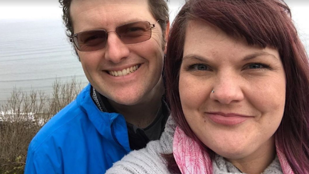 Lee Dingle (L) was killed when a wave slammed him into the sand while he was at the beach with three of his children.