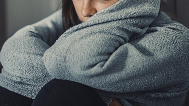 Close up of young woman struggling from mental breakdown