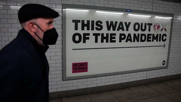 A man wearing a face mask in an underpass leading to Westminster underground train station, in London in January.