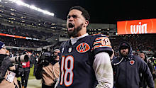 Caleb Williams celebrates after an NFL Wild Card game.