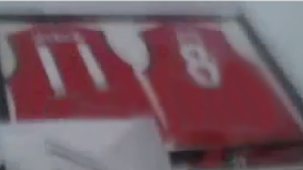 Red football jerseys framed for posterity.