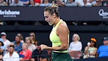 Aryna Sabalenka celebrates after winning a point.