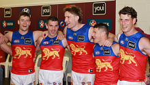 Brisbane Lions players sing their song after defeating Port Adelaide.
