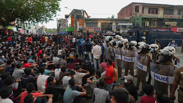 Hundreds of Sri Lankan protesters block a highway during a nationwide curfew in Colombo. 