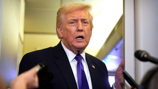 President Donald Trump speaks to reporters as he flies aboard Air Force One from Joint Base Andrews, Md., to West Palm Beach, Fla., Friday, Feb. 6, 2026 (AP Photo/Mark Schiefelbein)