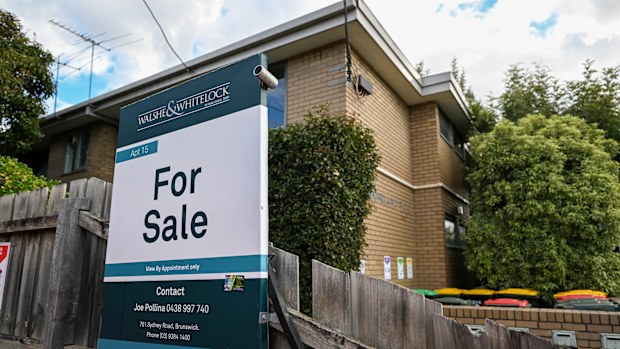 A for sale sign on a home.