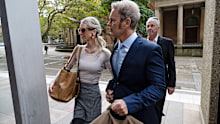 Craig McLachlan and his wife Vanessa Scammell enter Supreme Court on Wednesday May 11.