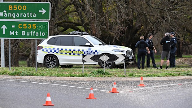 Police at the scene in Porepunkah, where two officers were shot dead and another injured while serving a warrant.