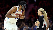 Joel Embiid #21 of the Philadelphia 76ers argues a call with referee Jenna Schroeder.
