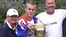 Lleyton Hewitt with his Wimbledon trophy alongside parents Cherilyn and Glynn.