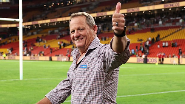 Former Broncos coach Kevin Walters gestures to the crowd.