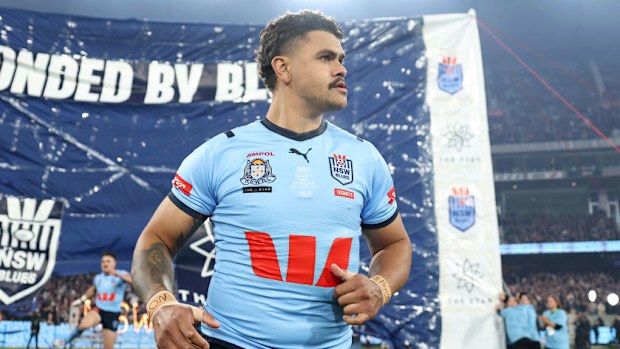 Latrell Mitchell runs onto the field.