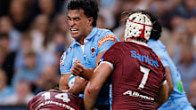 Joseph-Aukuso Suaalii of the Waratahs is tackled.